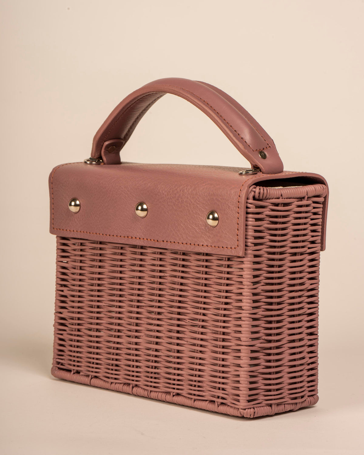 Wicker Wings handwoven Kuai dusk bag, in profile.
