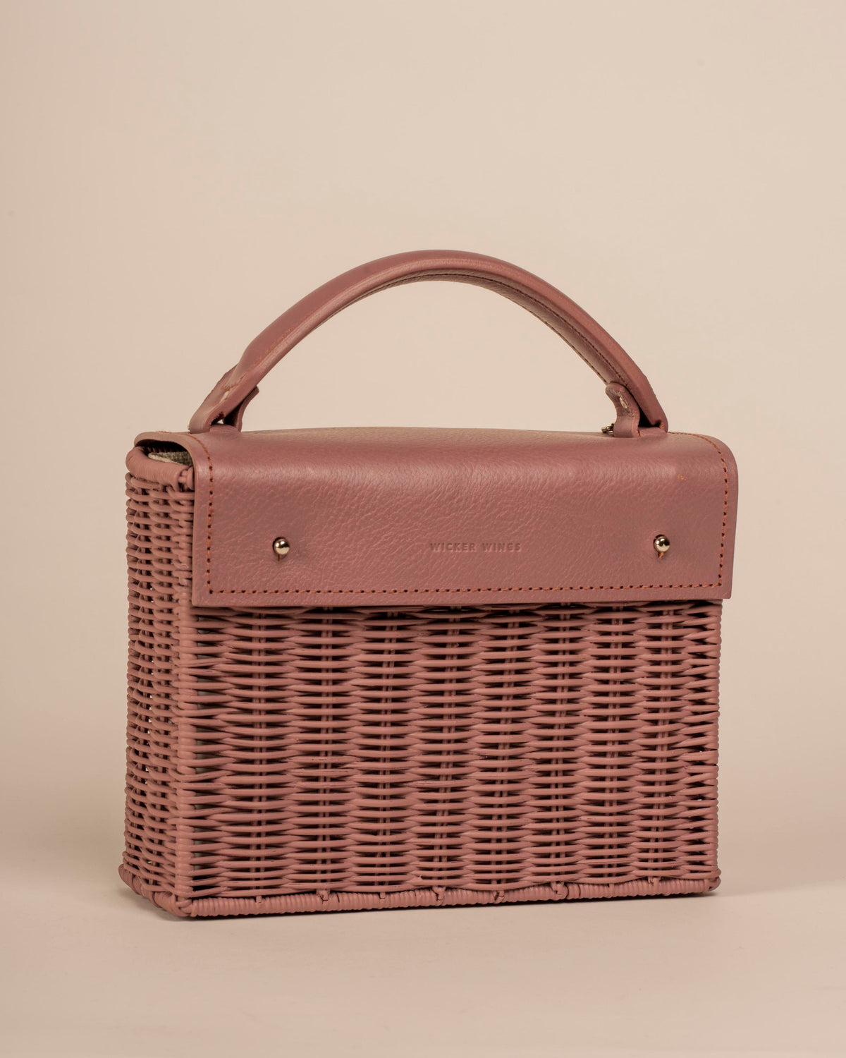 Wicker Wings handwoven Kuai dusk bag, shown at an angle.