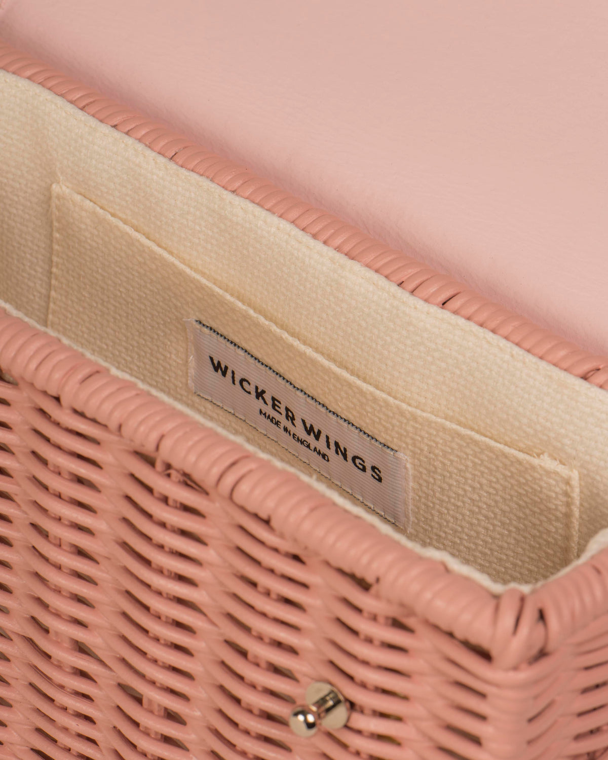 Wicker Wings Kuai handwoven wicker bag, pink, interior close up