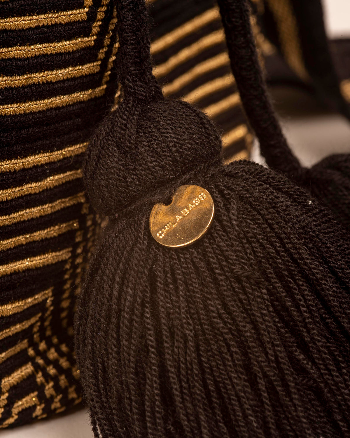 CHILA BAGS Tokyo Gold Bucket Bag, tassel detail